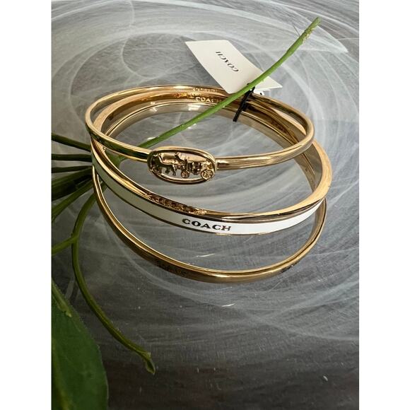 Coach Jewelry - NWT Coach horse & carriage gold, white enamel 3-piece bangle bracelet set size S